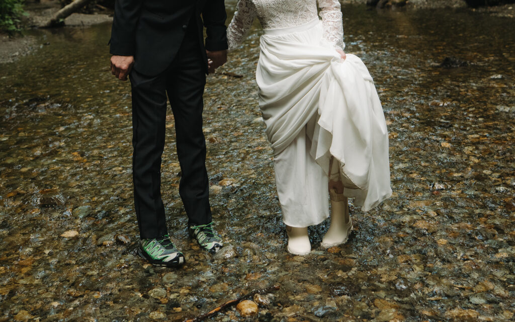 Bride and groom in Fern Canyon stream