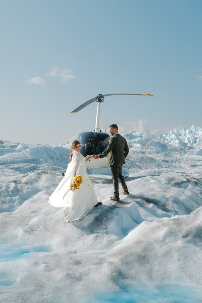 Alaska Glacier Elopement Couple with helicopter